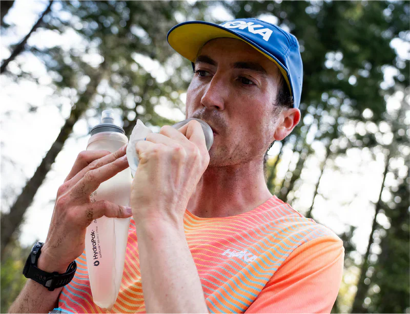 runner drinking from bottle