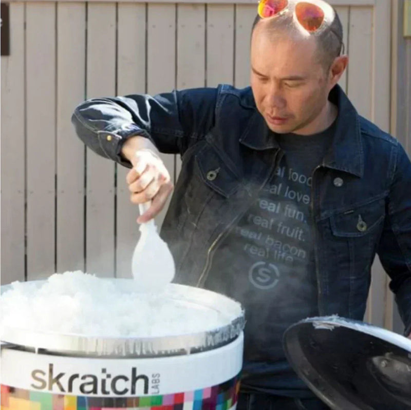 allen lim stirring a pot of rice