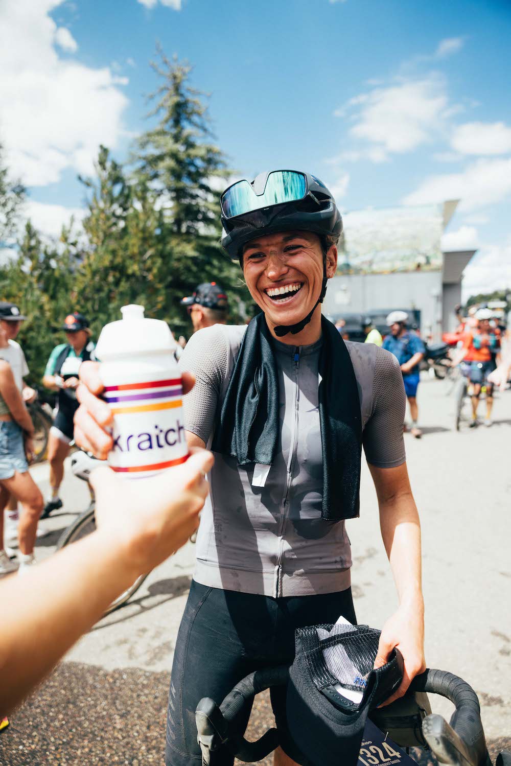 cyclist with bottle and smiling