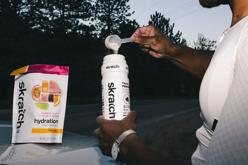 sport hydration mix pouring into bottle