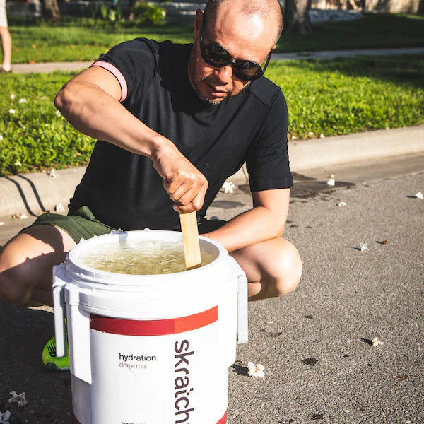 allen lim stirring mix in a cooler